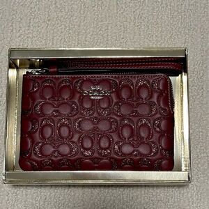 Brand new Coach Corner Zip Wristlet in Glittered Wine with Original Gift Box